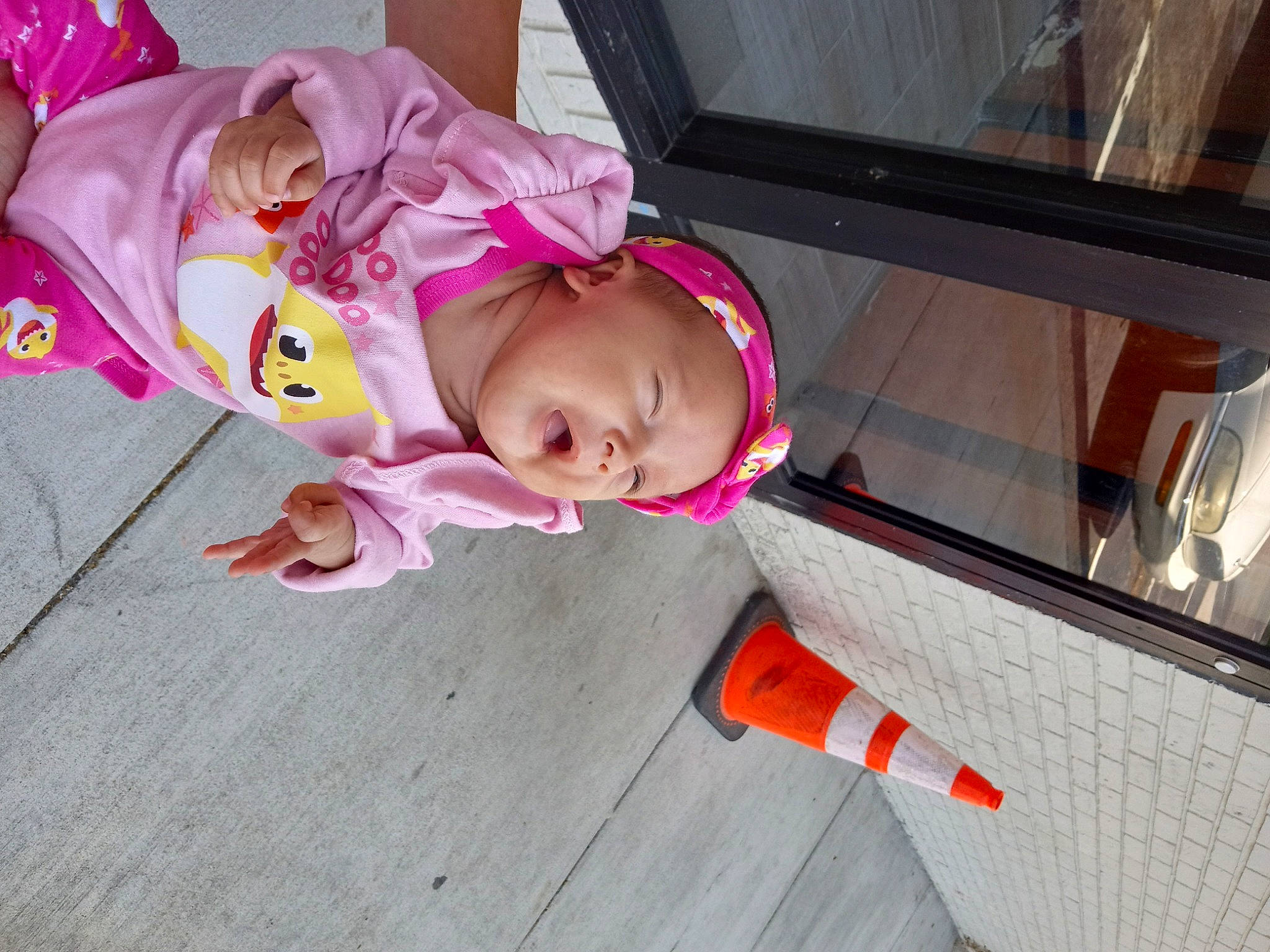 Grace is registered to the contest to win money with this photo: baby, baby_products, baby_toddler_clothing, carmine, child, costume, flooring, fun, hardwood, hat, headwear, magenta, person, room, sitting, skin, toddler, vacation, wood