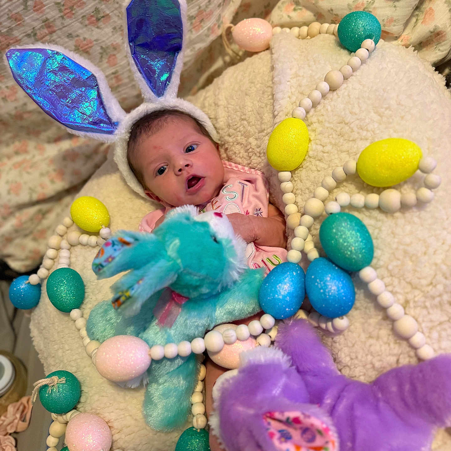 Ailani is registered to the contest to win money with this photo: accessories, baby, bed, clothing, doll, egg, face, food, furniture, hat, head, jewelry, newborn, people, person, photography, portrait, purple, sweets, toy