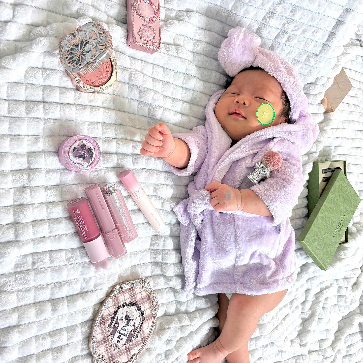 Sophia joined the competition — help win amazing prizes! baby, bed, blanket, child, cosmetics, cute, face, foot, hand, headband, indoors, infant, lavender, makeup, mirror, resting, robe, skin, sleeping, soft