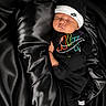 baby, sleeping, black_clothing, nike, hat, mittens, socks, fabric, satin, soft, newborn, portrait, cute, resting, cozy, infant, child, apparel, fashion, comfort
