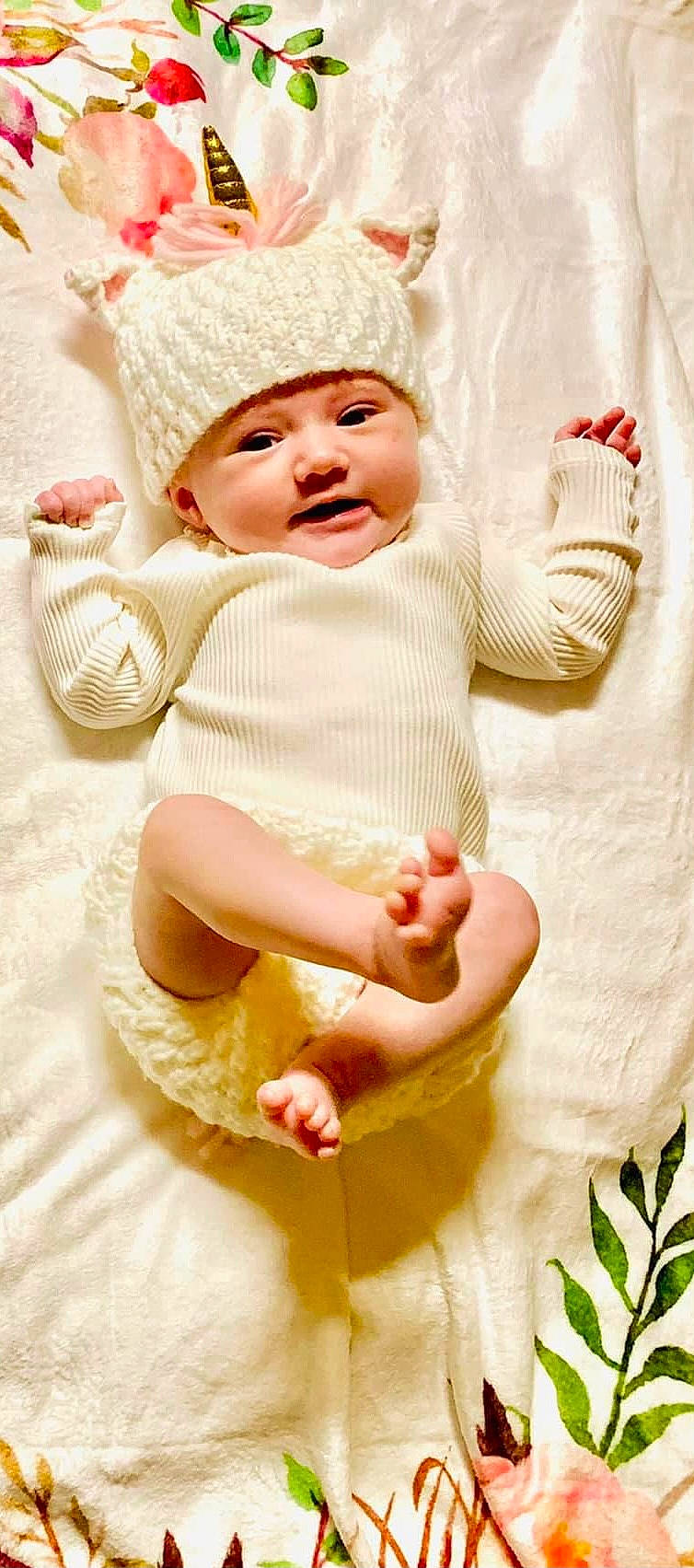 Addilyn is registered to the contest to win money with this photo: baby, baby_toddler_clothing, cap, cheek, clothing, comfort, face, facial_expression, hand, hat, headgear, headwear, human, organ, outerwear, person, photograph, product, skin, sleeve