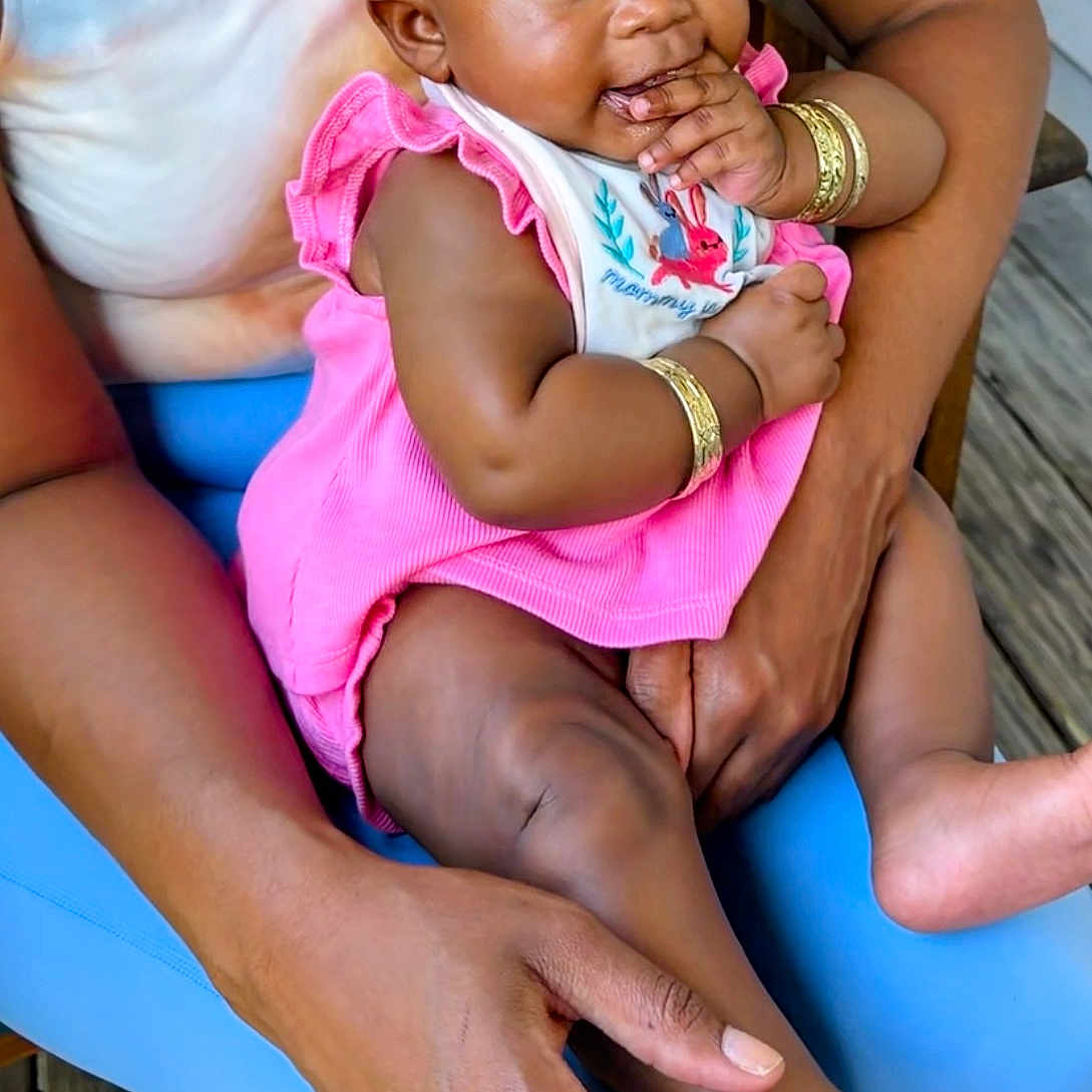 Bmw joined the competition — help win amazing prizes! baby, child, infant, portrait, smiling, pink_bow, pink_dress, headband, sitting, being_held, adult, arms, bracelets, blue_chair, indoor, wooden_floor, family, fashion, closeup, happy