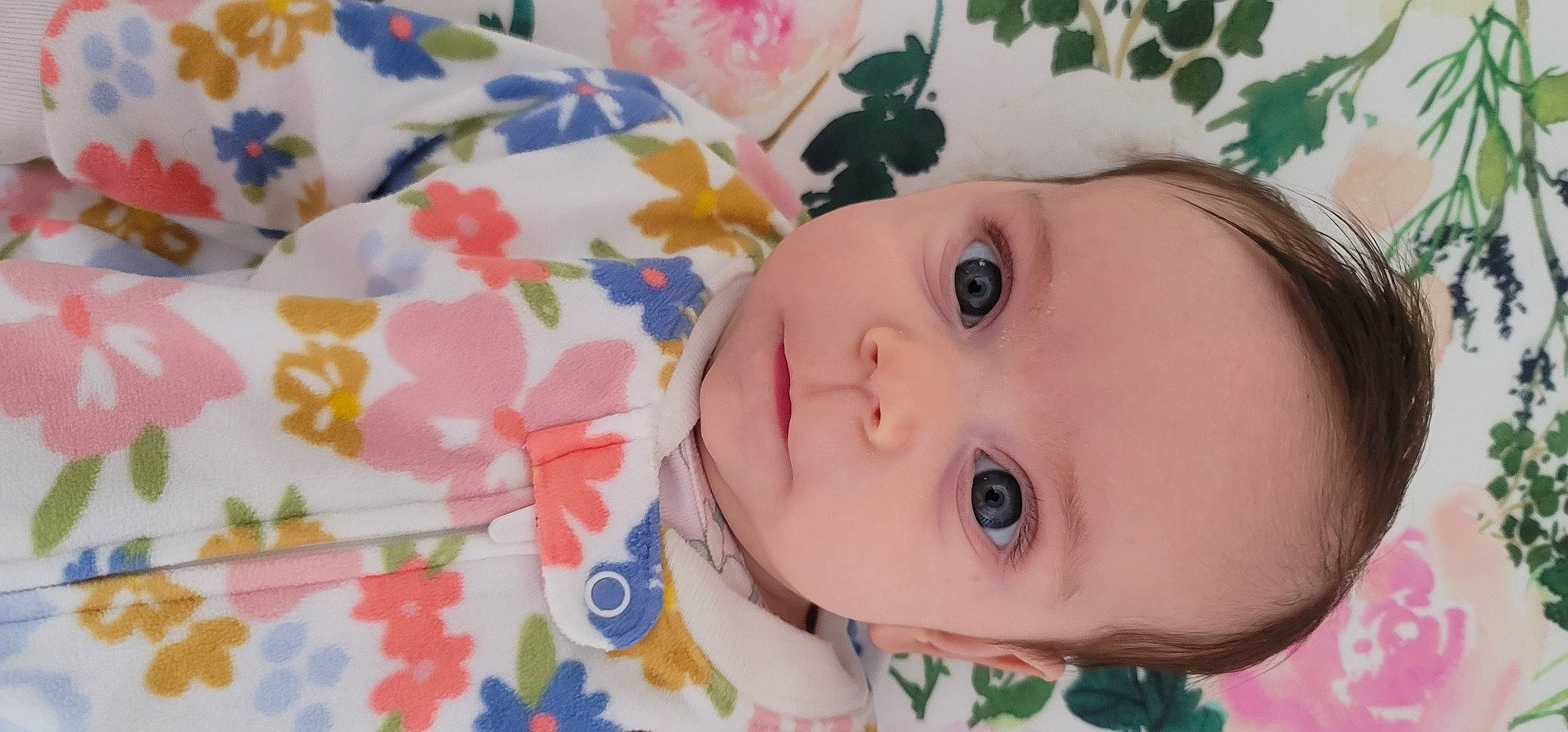 Jocelyn is registered to the contest to win money with this photo: baby, baby_toddler_clothing, brown_hair, cheek, child, chin, close_up, eye, eyebrow, eyelash, forehead, happy, headgear, iris, lip, nose, pattern, person, pink, skin