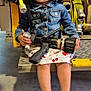 Elianah participe au concours pour gagner de l'argent avec cette photo : child, cute, denim, equipment, expression, firefighter, firehose, floor, helmet, holding, hose, indoor, jacket, metal_step, person, shoes, sitting, socks, toddler, young