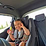Elianah participe au concours pour gagner de l'argent avec cette photo : car_interior, car_seat, child, clothing, cute, daylight, face, hair, happy, interior, joyful, person, playful, safety, seat, seatbelt, smile, toddler, vehicle, window