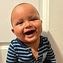 Enoch joined the competition — help win amazing prizes! baby, smiling, striped_clothing, onesie, indoor, child, happy, face, head, bald, portrait, infant, cute, young_child, toddler, door, background, light, person, joyful