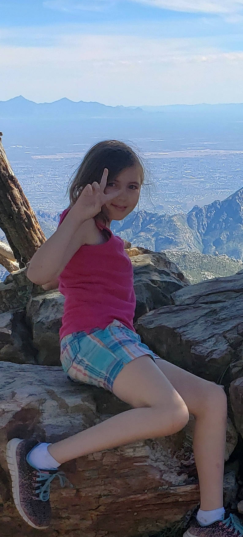 Alexis joined the competition — help win amazing prizes! beauty, black_hair, fun, human_leg, joy, leg, leisure, long_hair, mountain, person, sitting, thigh, tourism, vacation