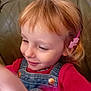 Elsa a rejoint le concours — aidez-le/la à gagner de superbes lots ! child, smile, red_shirt, denim_overalls, hair_clip, pink_accessory, blond_hair, couch, indoor, face, happy, closeup, person, casual_clothing, portrait, young, cute, childhood, motion_blur, relaxed