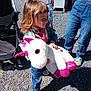 Elsa a rejoint le concours — aidez-le/la à gagner de superbes lots ! child, stuffed_toy, unicorn, outdoor, gravel, denim, sneakers, scarf, toy, person, happy, curly_hair, sunlight, stroller, adult, jeans, shoes, playful, smiling, casual_clothing