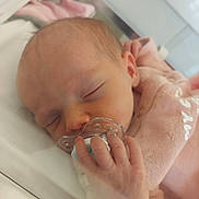 Andréa participe au concours pour gagner de l'argent avec cette photo : newborn, baby, sleeping, pacifier, hand, blanket, pink, infant, closeup, face, skin, hospital, nursery, peaceful, resting, child, young, cute, indoors, soft