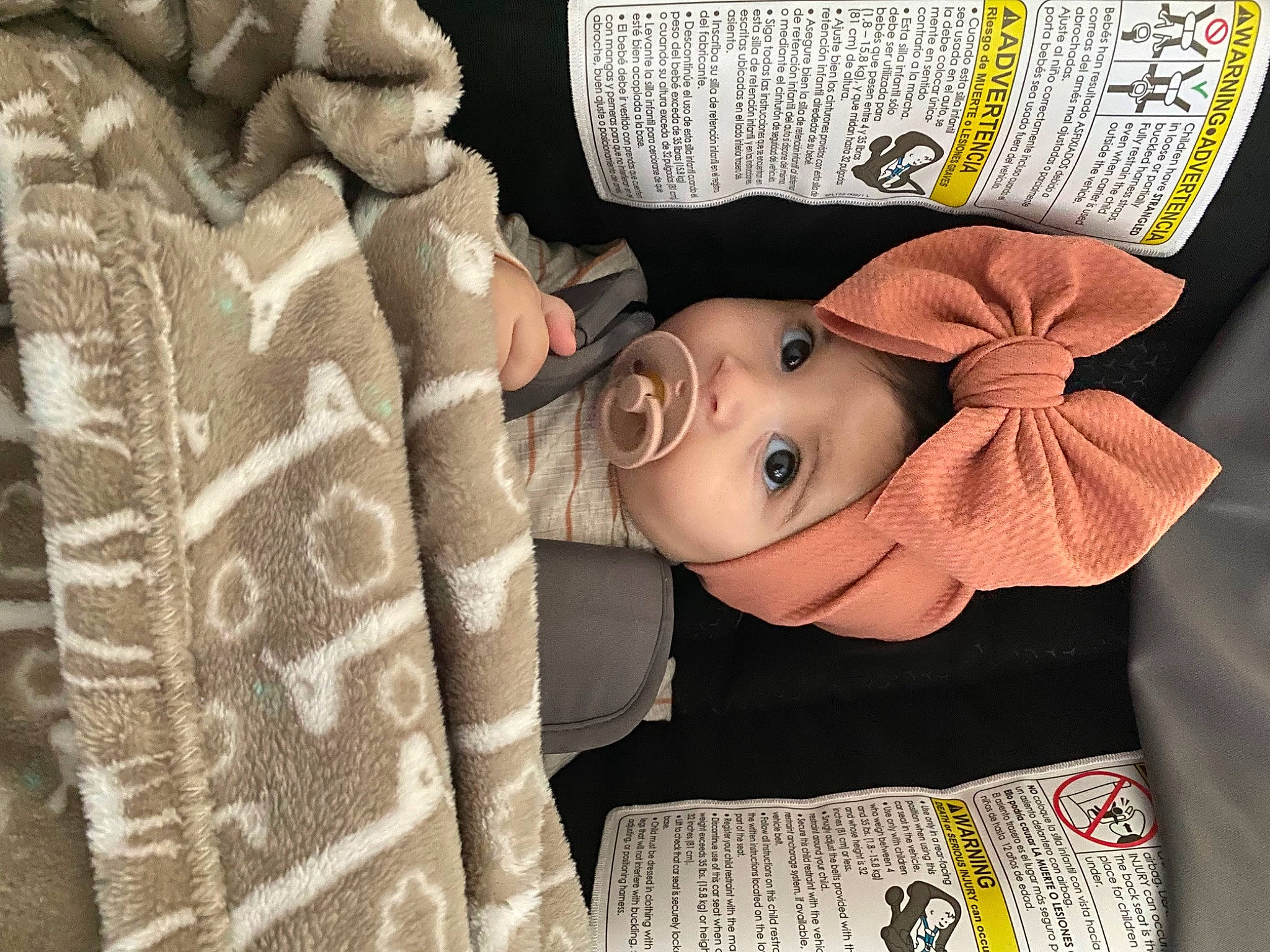 Arya is registered to the contest to win money with this photo: baby, baby_products, baby_toddler_clothing, cap, child, costume_hat, doll, eyelash, fashion_accessory, happy, hat, headgear, headwear, linens, pattern, person, room, sleeve, textile, toddler