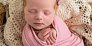 Ainsley Kay is registered to the contest to win money with this photo: newborn, baby, sleeping, pink_blanket, headband, crochet_lace, wrapped, peaceful, close_up, portrait, infant, soft_texture, delicate, cute, resting, hands_together, toes, cozy, indoors, warm_colors