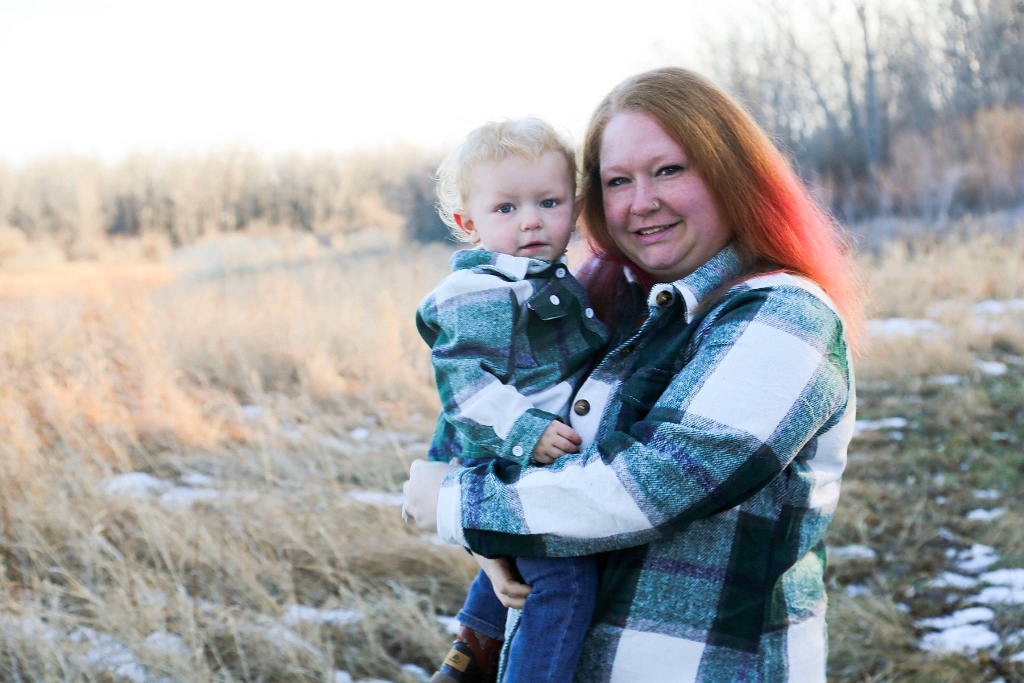 Charles is registered to the contest to win money with this photo: face, flash_photography, gesture, grass, grass_family, grassland, happy, interaction, iris, jacket, joy, meadow, outerwear, people_in_nature, person, plant, sky, smile, tartan, toddler
