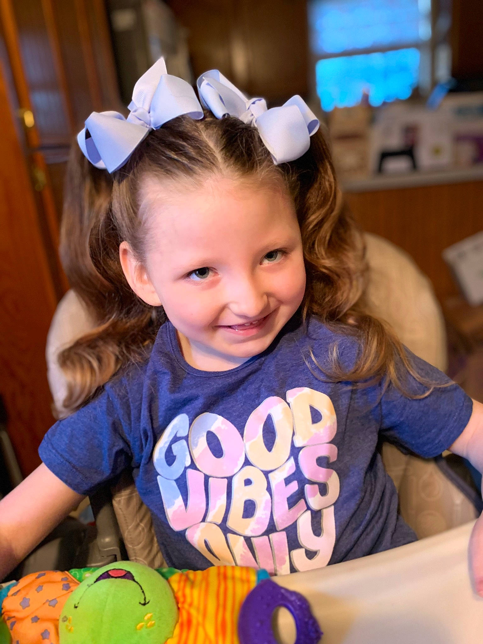 Sadie is registered to the contest to win money with this photo: baby_toddler_clothing, beauty, blond, calabaza, child, cucurbita, event, facial_expression, fashion_accessory, fun, gourd, happy, iris, joy, leisure, person, pumpkin, sitting, smile, t_shirt