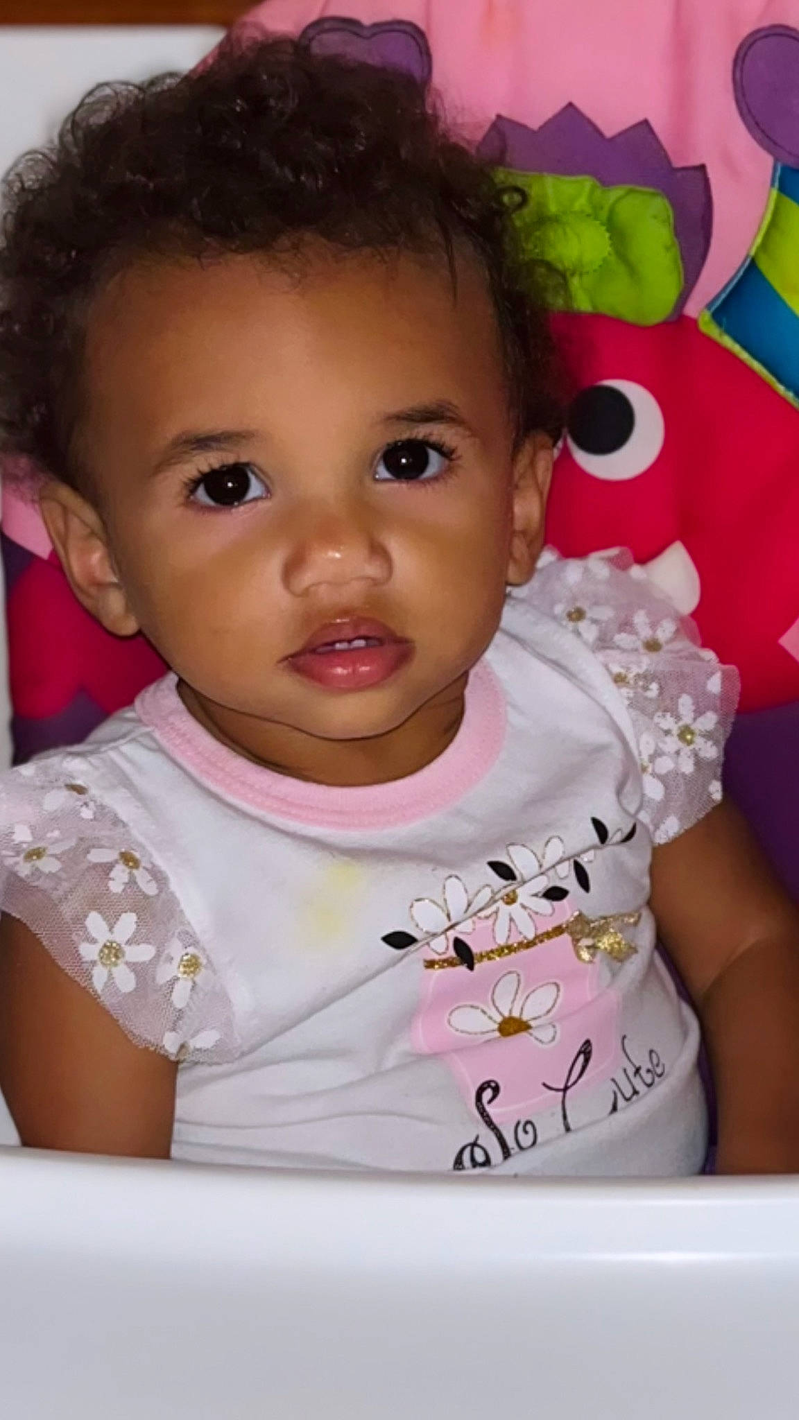 Melly is registered to the contest to win money with this photo: baby, baby_toddler_clothing, cheek, child, eyelash, fun, happy, iris, lip, magenta, nose, person, pink, portrait_photography, room, skin, sleeve, smile, sweetness, t_shirt