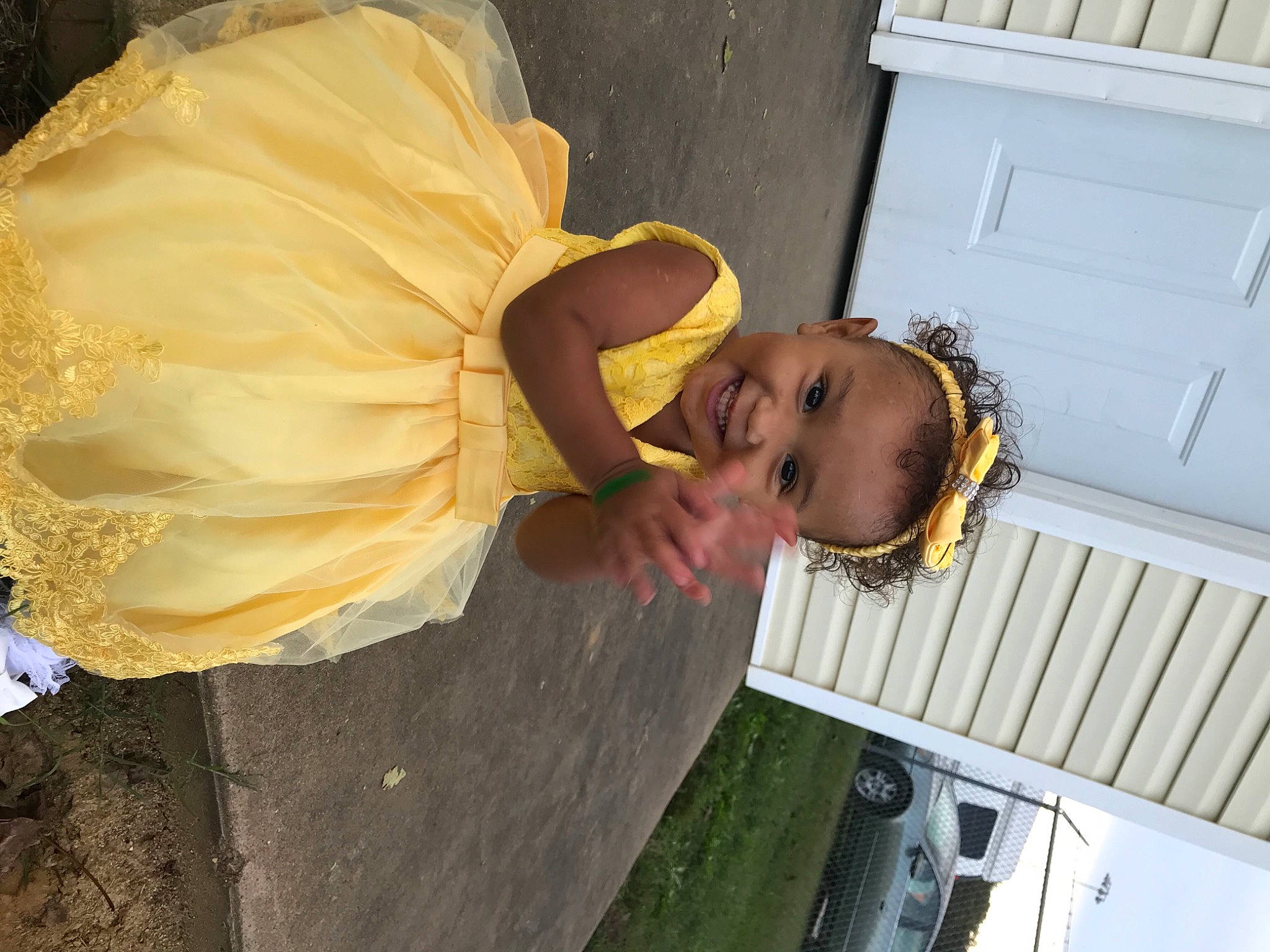 Chezney joined the competition — help win amazing prizes! baby, bridal_accessory, child, cut_flowers, door, dress, flower, fun, grass, hat, house, joy, person, petal, plant, siding, smile, toddler, tree, vacation