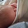 Noah joined the competition — help win amazing prizes! newborn, baby, infant, sleeping, blanket, swaddled, close_up, portrait, head, hair, skin, hand, fingers, cozy, indoors, soft, textile, resting, peaceful, snuggling