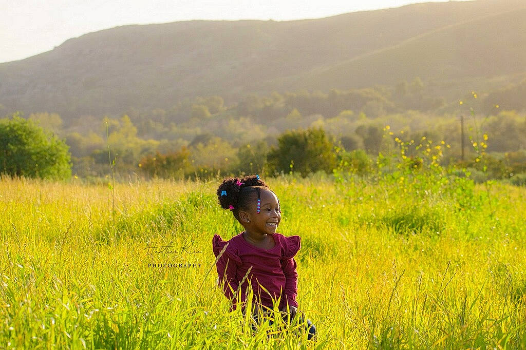 Zarya is registered to the contest to win money with this photo: ecoregion, grass, grassland, happy, hat, joy, landscape, leaf, mammal, morning, mountain, natural_environment, natural_landscape, nature, people_in_nature, person, plain, plant, sky, smile