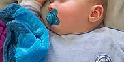 Darko a rejoint le concours — aidez-le/la à gagner de superbes lots ! baby, bed, blanket, blue, child, clothing, comfort, cozy, cute, face, head, infant, nap, pacifier, peaceful, person, resting, sleeping, soft, toddler
