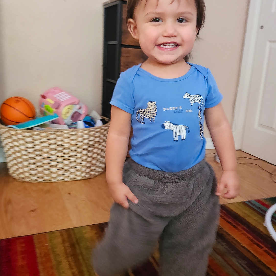 Milo is registered to the contest to win money with this photo: accessories, baby, bag, ball, basket, basketball, basketballball, clothing, face, handbag, hardwood, head, pants, person, photography, portrait, shorts, sport, t_shirt, wood