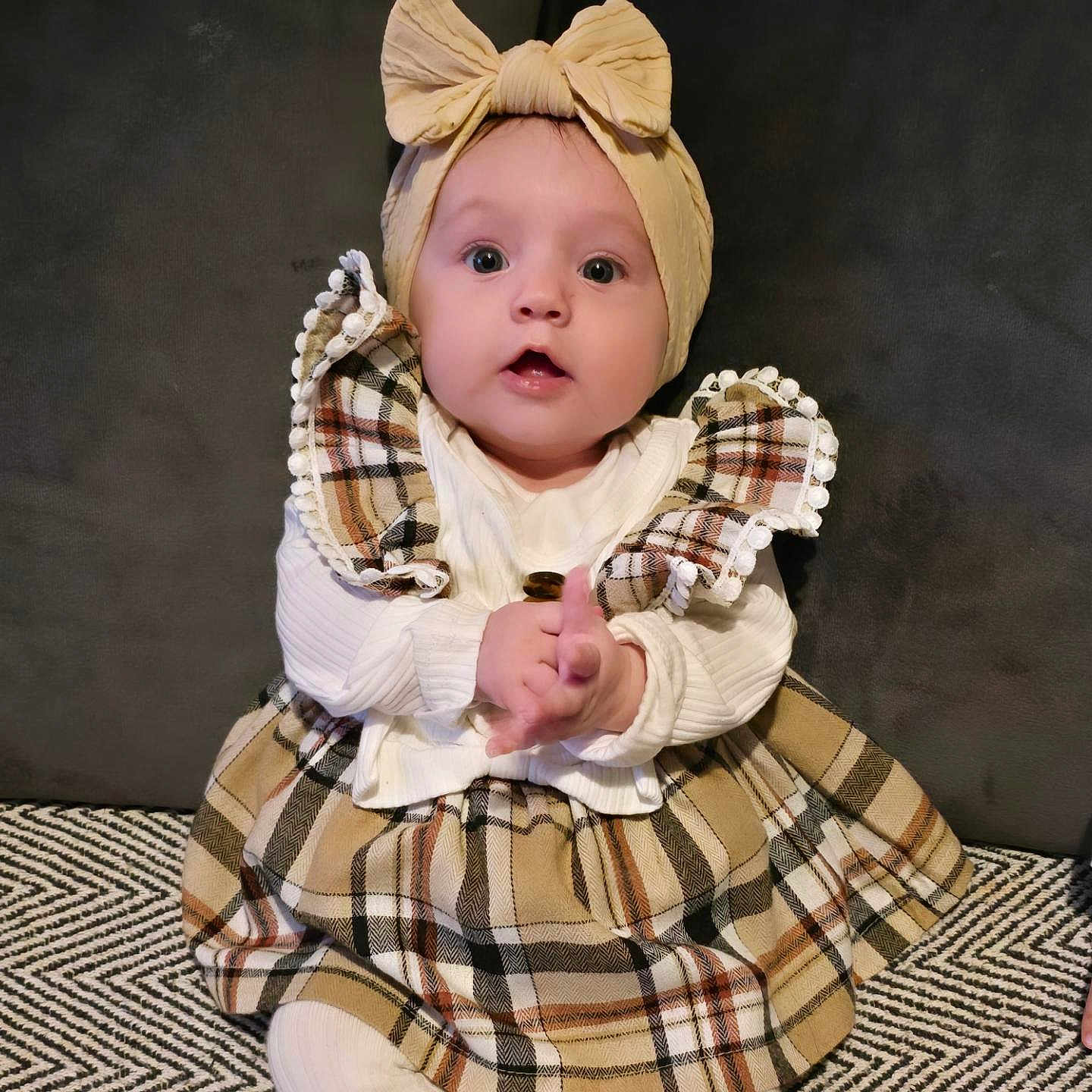 Aria joined the competition — help win amazing prizes! accessories, baby, bonnet, clothing, coat, costume, doll, dress, face, formalwear, hat, head, headband, pants, person, photography, portrait, sitting, sleeve, toy