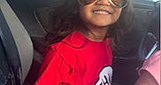Aurora joined the competition — help win amazing prizes! child, smiling, sunglasses, red_shirt, car_interior, seatbelt, garage_door, window, person, happy, casual_clothing, daylight, seat, vehicle, reflection, hair, indoors, portrait, young, sunlight