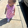 Azari joined the competition — help win amazing prizes! toddler, child, pink_dress, bow, sidewalk, outdoor, sunlight, shadow, white_sneakers, happy, curly_hair, earrings, concrete, car, green_grass, casual, smiling, walking, daytime, person