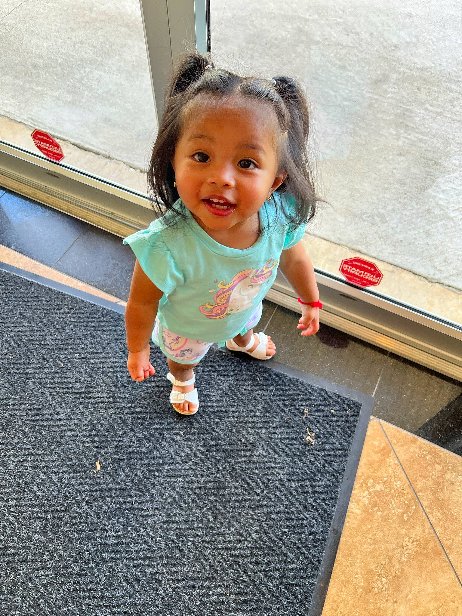 Laili joined the competition — help win amazing prizes! asphalt, baby_toddler_clothing, child, face, facial_expression, floor, flooring, foot, fun, hairstyle, happy, hardwood, human_leg, joint, leisure, person, road_surface, smile, standing, toddler