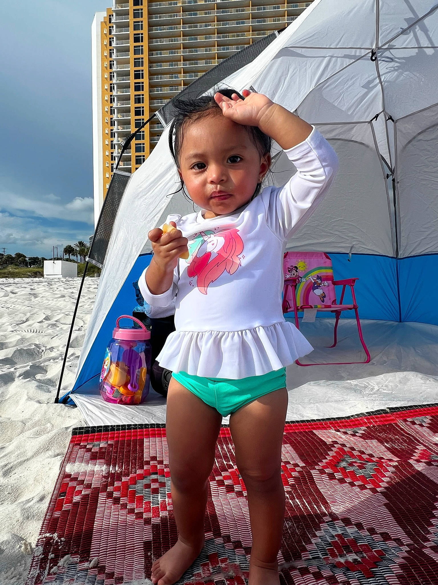 Laili joined the competition — help win amazing prizes! building, child, cool, event, fashion_accessory, fun, happy, human_leg, knee, leisure, magenta, person, pink, recreation, sitting, sky, thigh, toddler, travel, umbrella