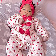 Antonella joined the competition — help win amazing prizes! baby, balloon, bow, cheeks, cute, dark_hair, elephant_print, feet, hand, headband, heart_pattern, indoor, infant, nursery, onesie, peaceful, pillow, pink, portrait, soft_light