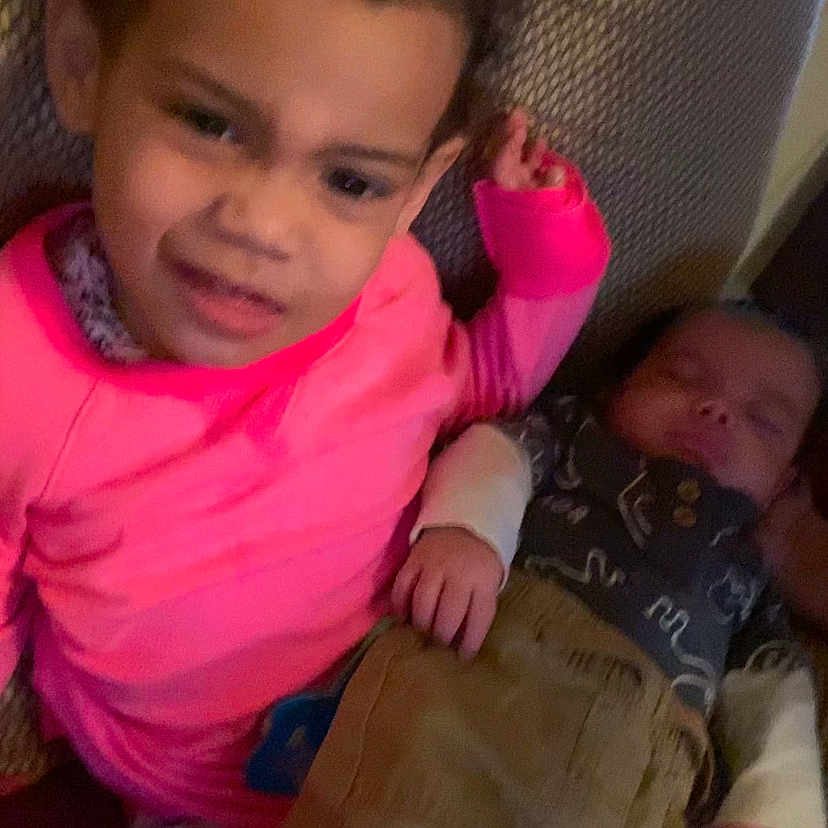 Jonaya joined the competition — help win amazing prizes! baby, bodypart, chair, clothing, couch, cushion, face, finger, furniture, hand, happy, head, homedecor, indoors, newborn, pants, person, photography, portrait, t_shirt