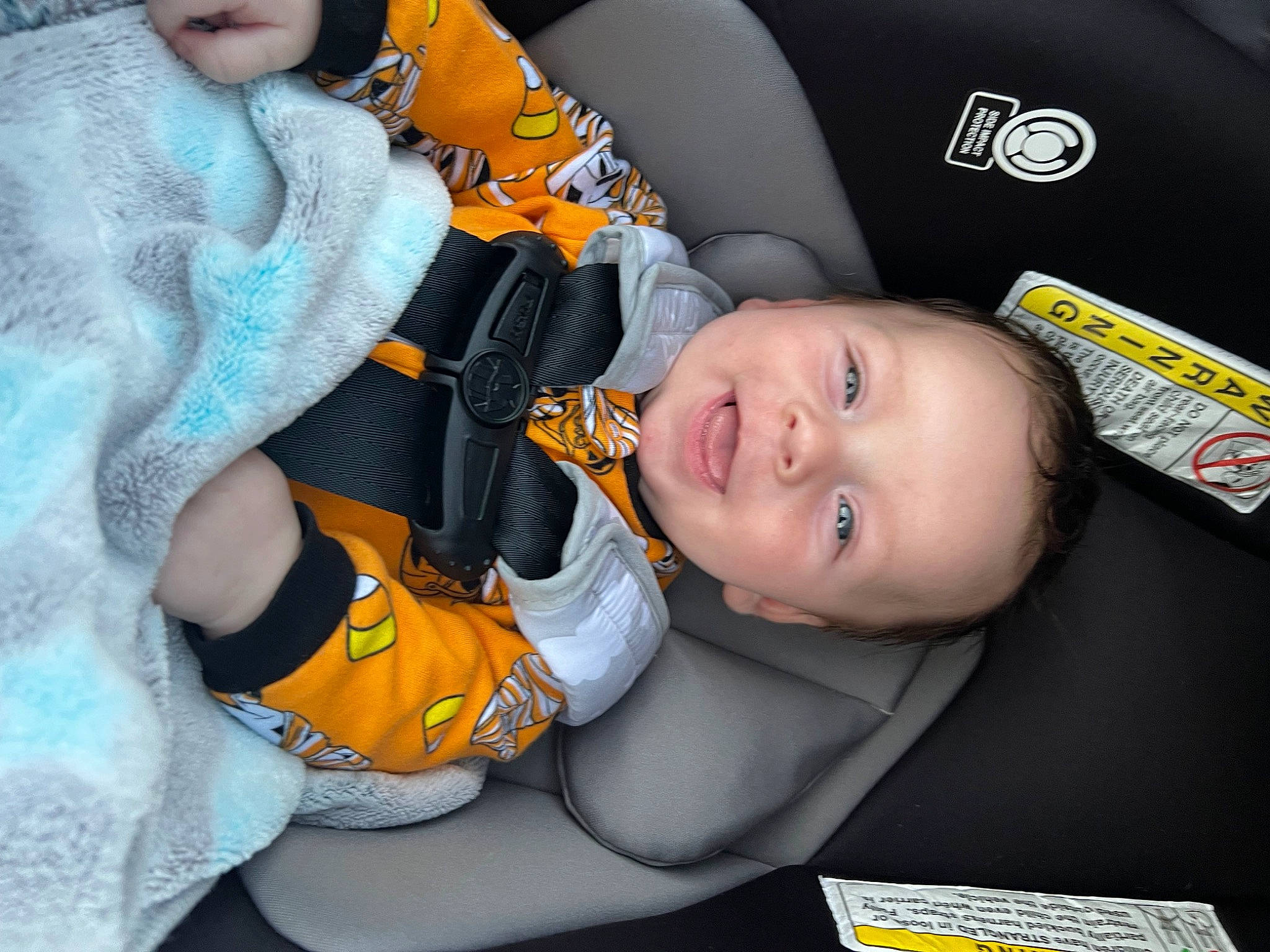 Camden is registered to the contest to win money with this photo: auto_part, baby, baby_carriage, baby_in_car_seat, baby_products, baby_safety, baby_sleeping, baby_toddler_clothing, car_seat, cheek, child, comfort, fun, happy, linens, person, room, sitting, smile, toddler