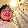 toddler, child, smile, happy, face, indoor, bathroom, curtain, light, mirror, tile, clothing, person, portrait, young_child, cheerful, cute, hair, closeup, joy