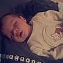 baby, sleeping, blanket, onesie, teddy_bear, beads, name_bracelet, cozy, infant, peaceful, soft, cute, child, indoors, portrait, resting, young, comfort, closeup, adorable