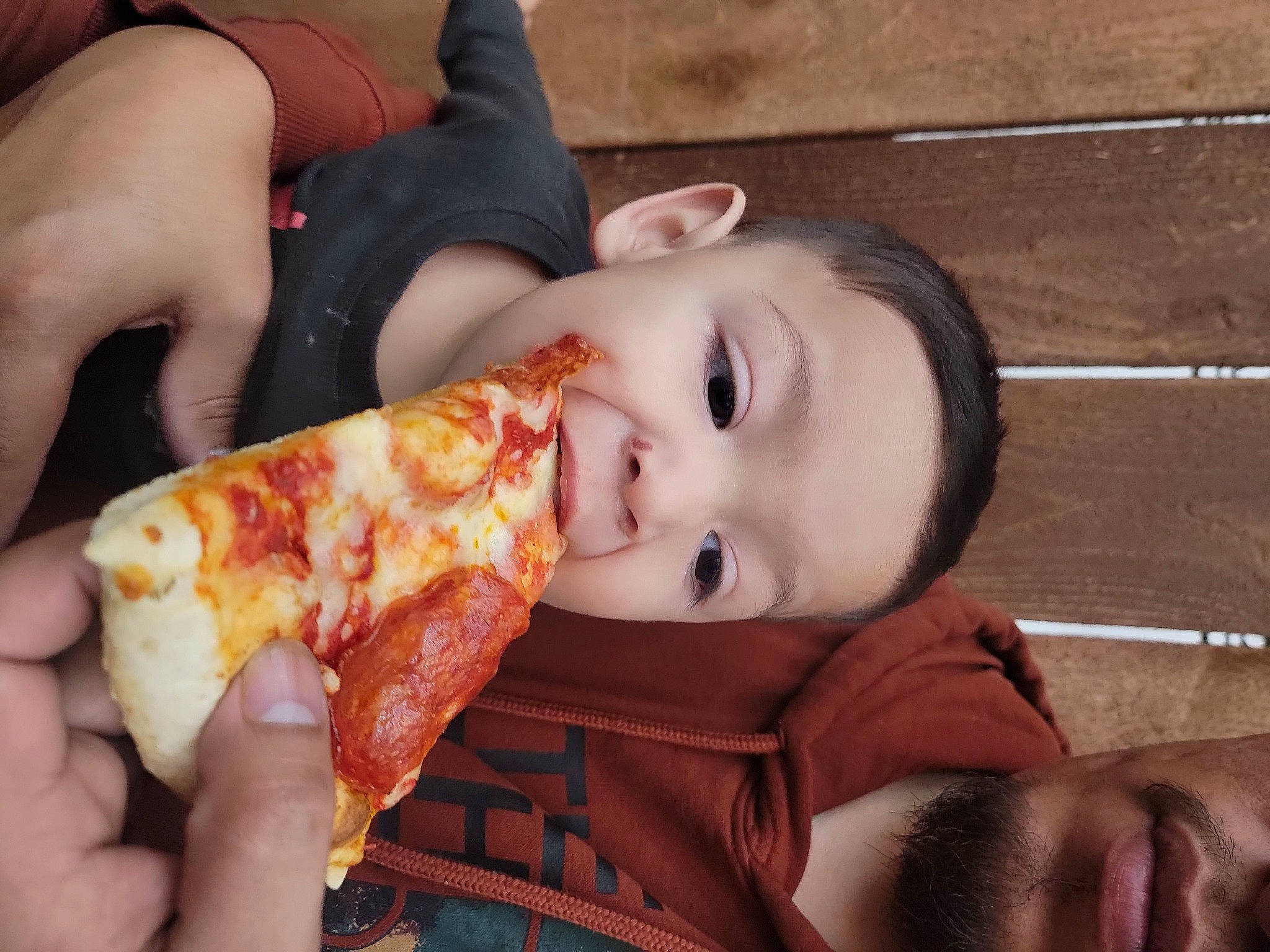 Vicente is registered to the contest to win money with this photo: child, comfort_food, cuisine, fast_food, food, food_craving, fun, hand, happy, human_body, ingredient, junk_food, lip, mouth, orange, pattern, person, pizza, recipe, tableware