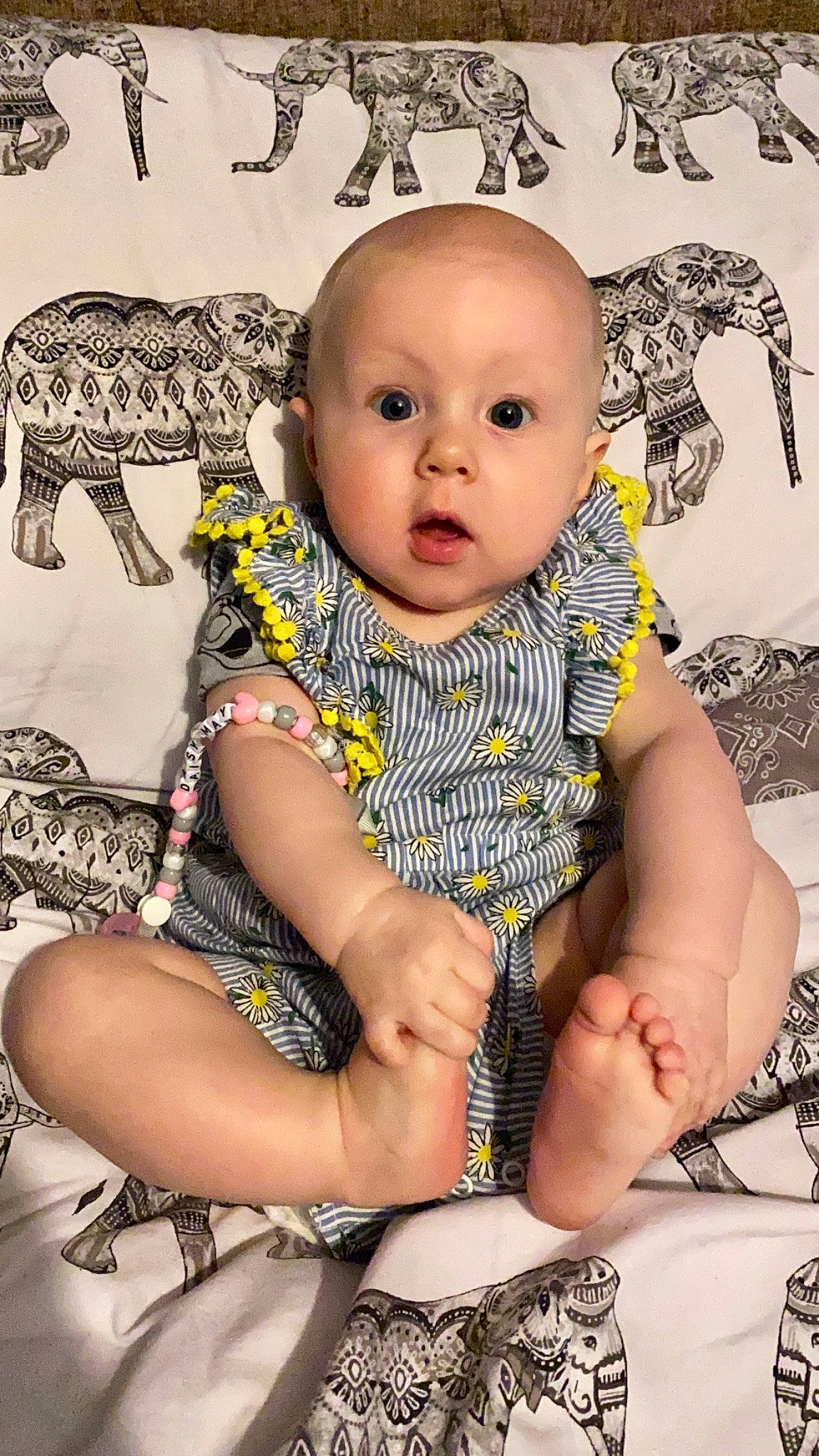 Daisy-may is registered to the contest to win money with this photo: baby, baby_toddler_clothing, black, cheek, child, comfort, eyelash, happy, iris, pattern, person, pink, product, sitting, skin, sleeve, style, surprise, terrestrial_animal, toddler