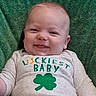 Evan joined the competition — help win amazing prizes! baby, infant, smile, green_blanket, clothing, shirt, shamrock, luckiest_baby, happy, face, cute, portrait, lying_down, child, skin, head, expression, indoors, one_person, toddler