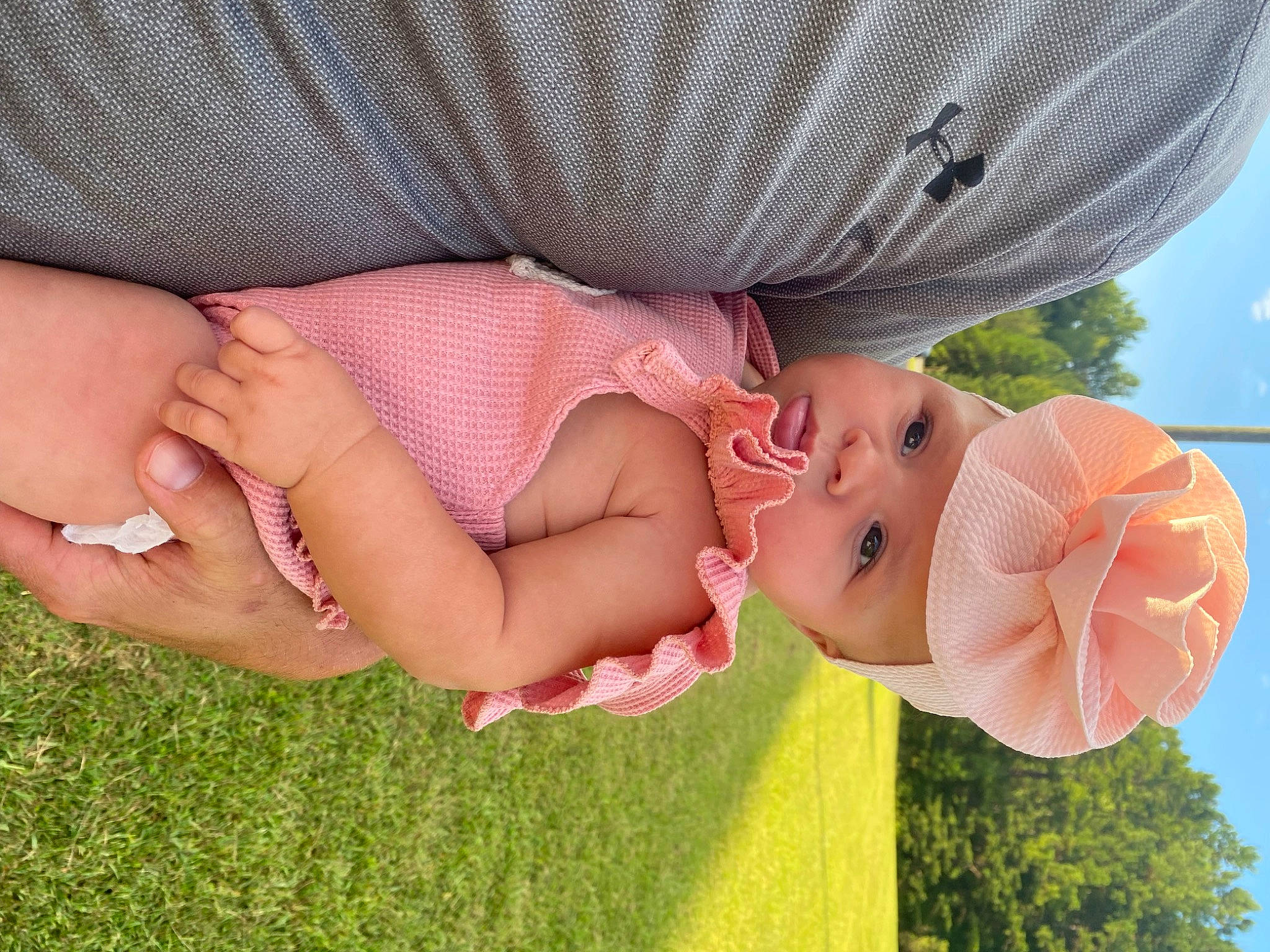 Bayleigh joined the competition — help win amazing prizes! baby, child, finger, fun, gesture, grass, happy, headwear, human_body, human_leg, leg, leisure, people_in_nature, person, petal, pink, plant, skin, textile, thigh