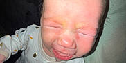 Eliyanah Jade is registered to the contest to win money with this photo: baby, crying, infant, onesie, close_up, face, person, child, expression, mouth_open, eyes_closed, skin, hair, sleepwear, indoor, human, young, emotion, upset, toddler