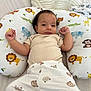 Imrane a rejoint le concours — aidez-le/la à gagner de superbes lots ! animal_print, baby, bear_pattern, bed, blanket, clothing, cute, elephant, face, giraffe, indoors, infant, lion, monkey, pants, pillow, raised_hands, shirt, smile, tiger