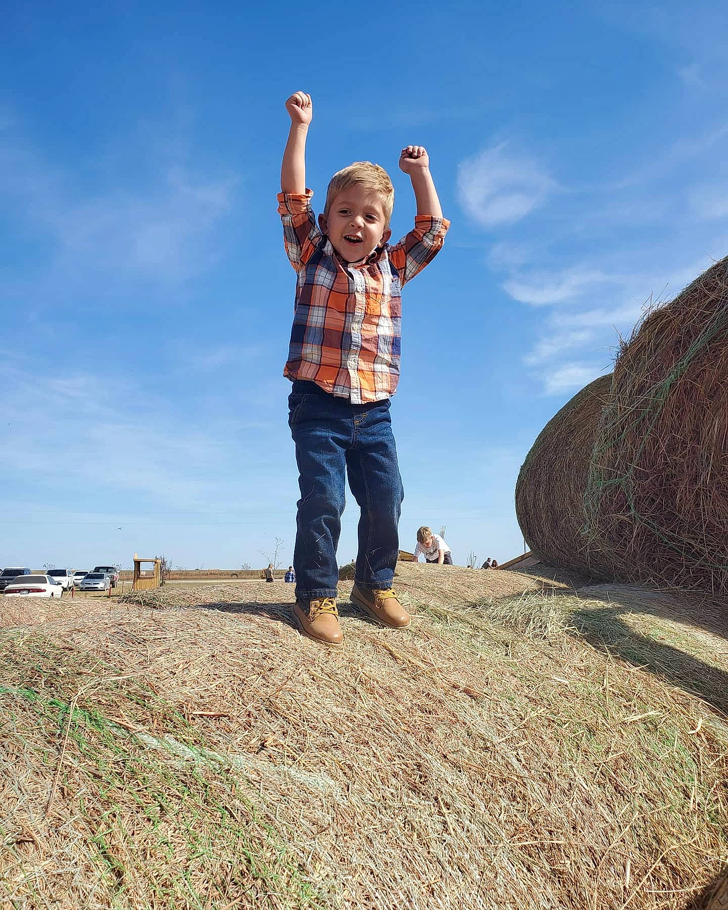 Zayne is registered to the contest to win money with this photo: child, cloud, fun, gesture, hand, happy, jumping, landscape, leisure, mountain, person, photography, plant, rock, sky, smile, soil, tourism, travel, tree