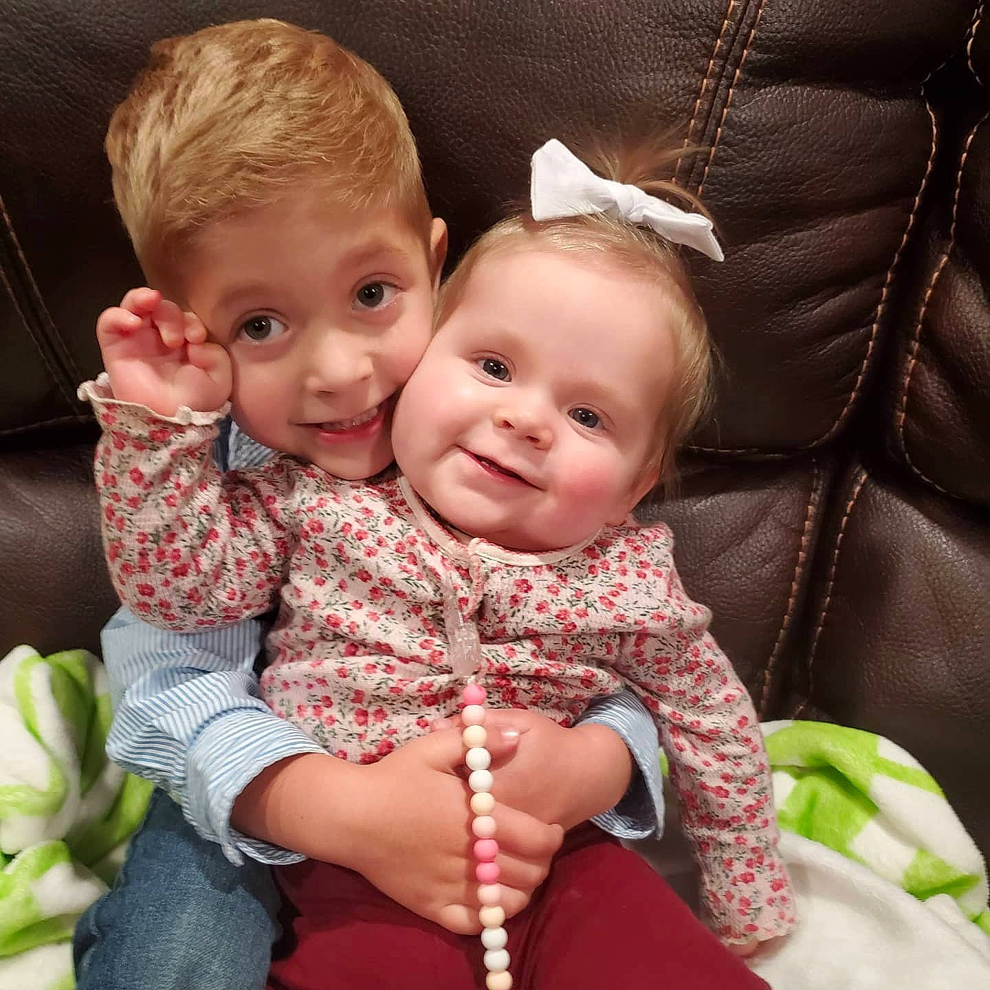 Zayne is registered to the contest to win money with this photo: baby, cheek, child, ear, eye, face, happy, head, interaction, iris, joy, lip, nose, people, person, pink, product, sibling, sitting, skin