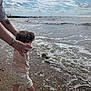 Aurelia joined the competition — help win amazing prizes! adult_hands, barefoot, beach, child, clouds, coast, curly_hair, exploration, holding_hands, nature, ocean, outdoor, sand, sea, shore, sky, summer, toddler, water, waves