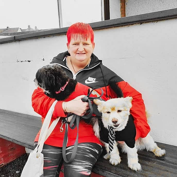 Rocky is registered to the contest to win money with this photo: boat, canidae, carnivore, companion_dog, costume, dog, dog_breed, fur, fur_clothing, leash, personal_protective_equipment, recreation, ship, smile, snout, sporting_group, watercraft, window, winter, working_dog