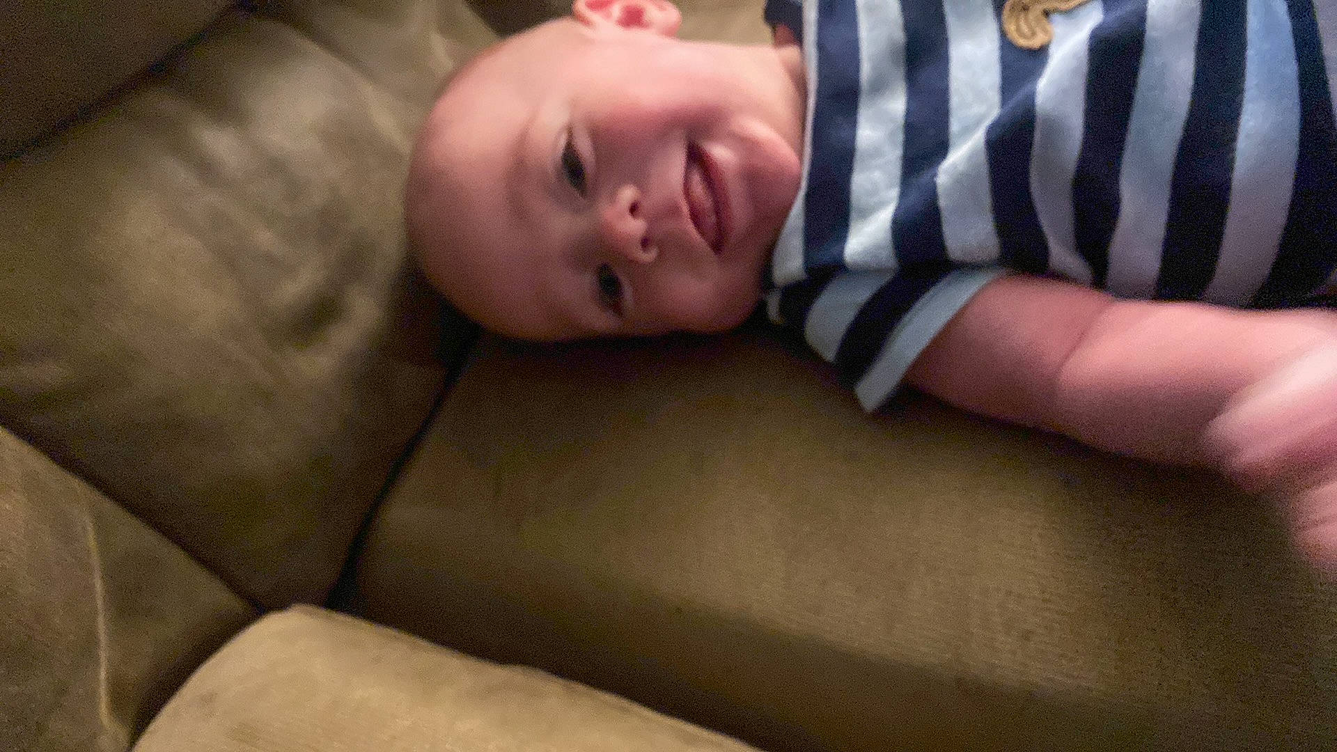 Matteo is registered to the contest to win money with this photo: baby, baby_toddler_clothing, cheek, child, comfort, elbow, face, flash_photography, flesh, flooring, head, human_leg, linens, pattern, person, portrait_photography, room, sitting, sleeve, smile