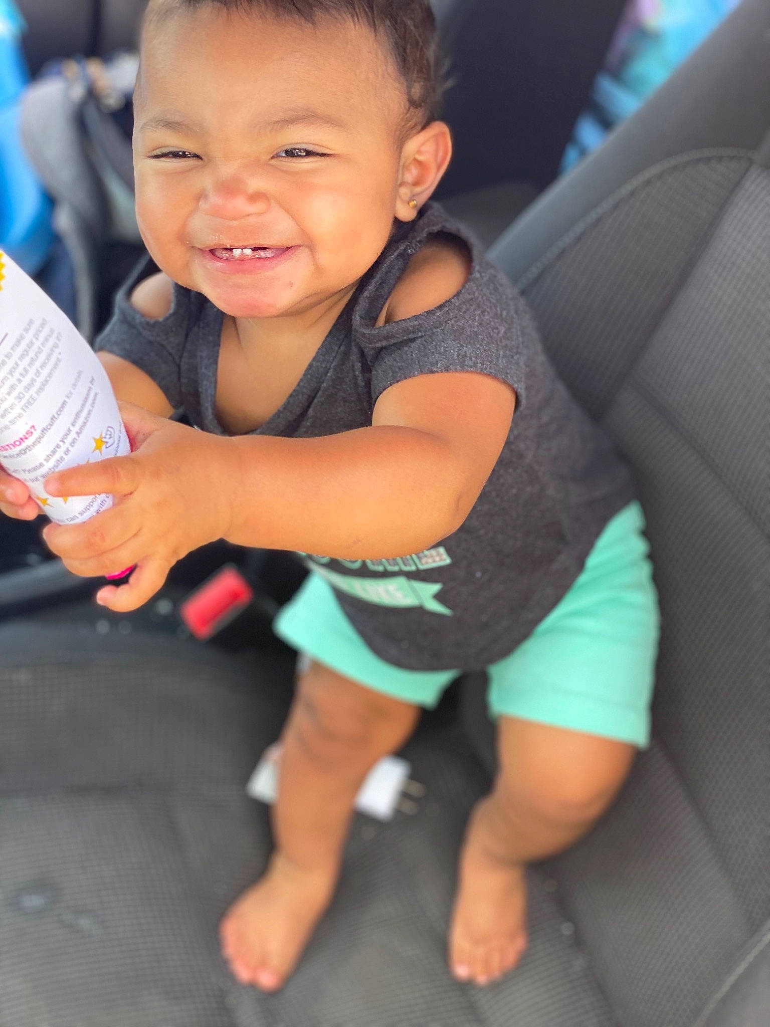 Hadilynn is registered to the contest to win money with this photo: arm, baby, cheek, child, facial_expression, finger, fun, hand, happy, joy, leg, person, play, skin, smile, thigh, thumb, toddler, vacation