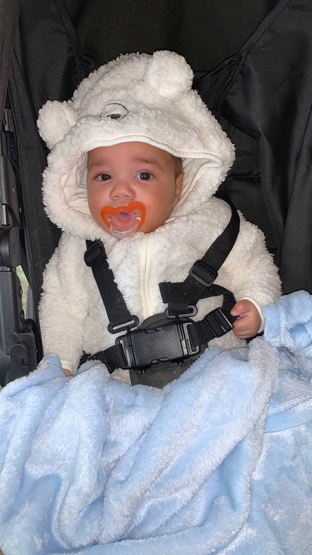 Allan is registered to the contest to win money with this photo: baby, baby_toddler_clothing, chair, cheek, child, comfort, costume, event, eye, eyebrow, fur, fur_clothing, hat, headgear, headwear, human_body, iris, lip, person, sitting
