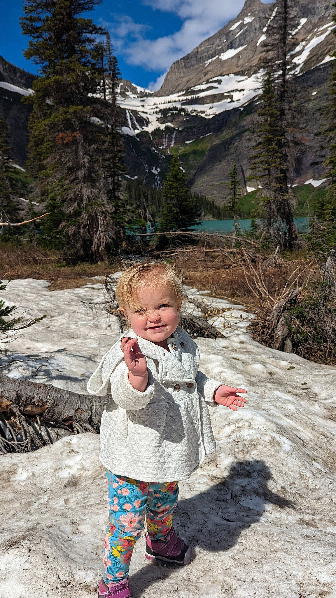 Bexley is registered to the contest to win money with this photo: body_of_water, cloud, fun, geology, grass, landscape, larch, leaf, leisure, mountain, mountain_range, people_in_nature, person, plant, recreation, rock, sky, snow, toddler, tree