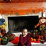 toddler, child, pumpkin, toy, fireplace, scarecrow, autumn, fall, decoration, carpet, dress, plush, indoor, holiday, thankful, orange, maroon, smiling, home, cozy