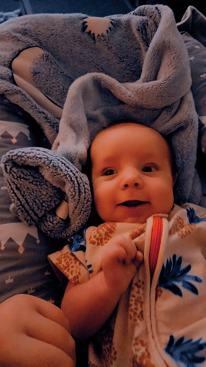 Bellamy is registered to the contest to win money with this photo: baby, cheek, comfort, eye, eyebrow, face, facial_expression, finger, gesture, hand, happy, head, human_body, iris, lip, mouth, nose, person, skin, smile